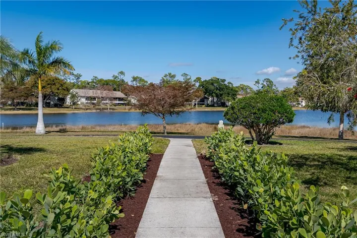 Surrounding community featuring a water view
