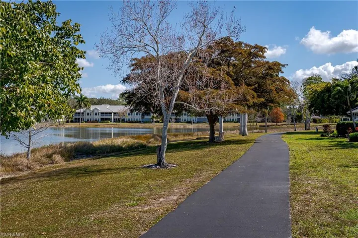 View of home's community with a water view