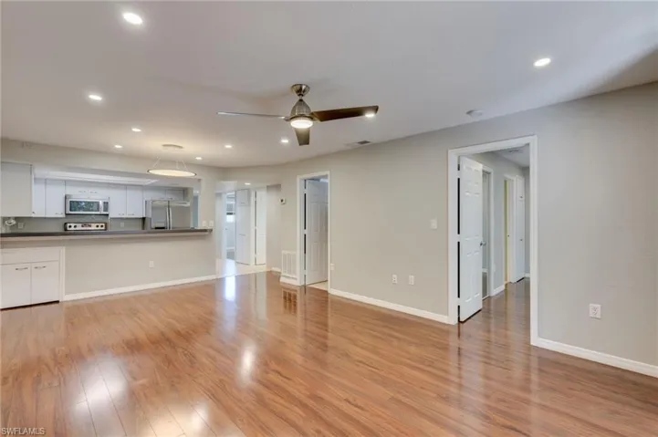 The open-concept kitchen, living, and dining areas are centered on an efficient three-bedroom floor plan with ample built-in storage.
