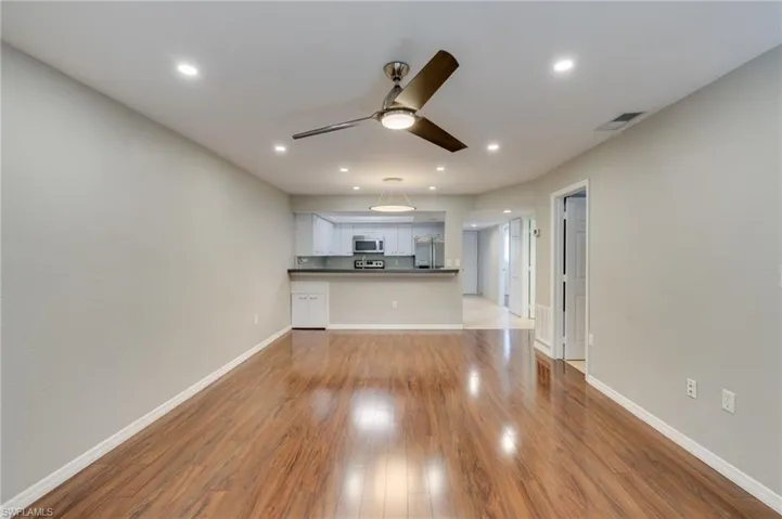 Main living and dining large open space with out virtual staging.