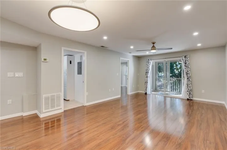 Laundry and utility room and primary bedroom set immediately off the living spaces.