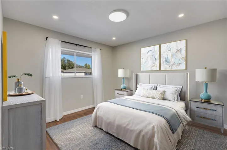 Virtually staged: The west guest room is slightly larger than the other guest room and features new flush mount LED ceiling lights on dimmer switches and is immediately adjacent to the guest bathroom.