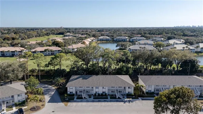 The condo unit's building (#2370) sits with south exposure over Stoney Brook's serene golf course and includes the dividing berm with shade trees.