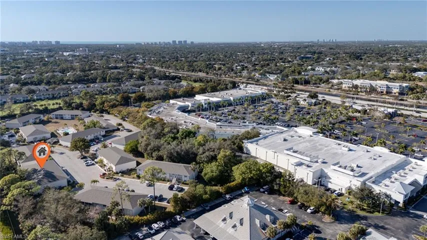The pin identifies the condo building and shows its preferred location with shade trees and also it's proximity to green tree Plaza at the corner of airport pulling in Immokalee Road with an extensive offering of shops and restaurants.