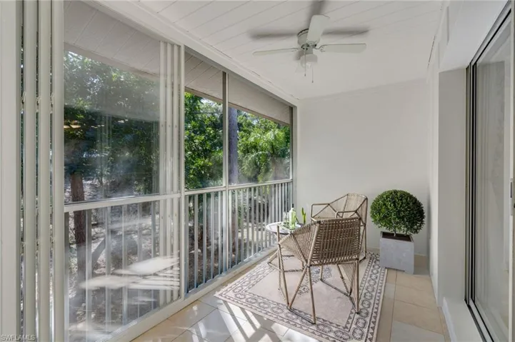 Virtually Staged: The south-facing large lanai is bright and airy with fresh paint, professionally cleaned grout, and retractable slider panels for year-round enjoyment.