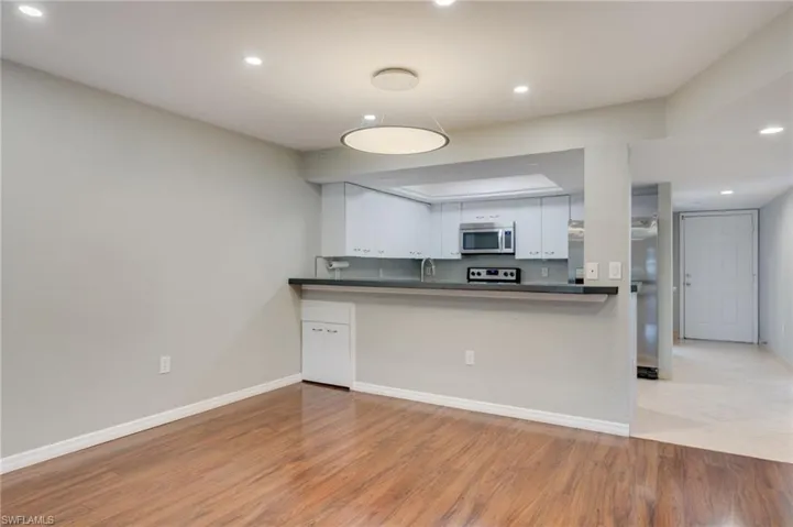 Open kitchen and dining area without virtual staging.