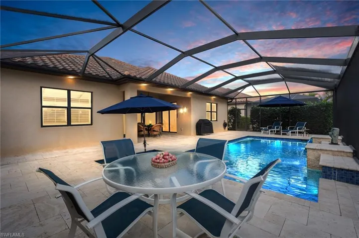 Outdoor pool featuring a patio area, a grill, and outdoor dining space