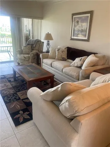 Living room with light tile patterned floors