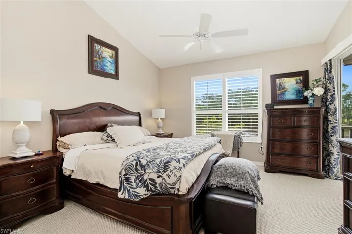Primary suite enjoys stunning views, private lanai access, and an ensuite bath with dual vanities, a separate soaking tub, and a glass-enclosed shower.