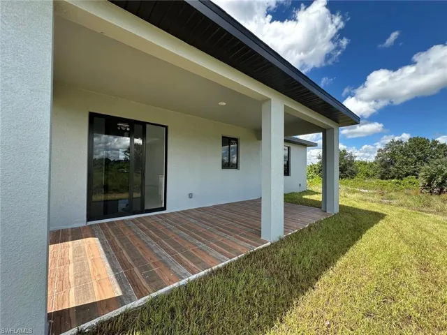 Deck featuring a yard and a patio