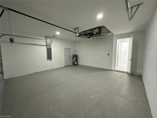 Garage with electric panel and water heater