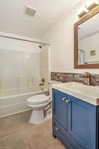 This 3rd full bath comes with a combo shower / tub and updated blue vanity.