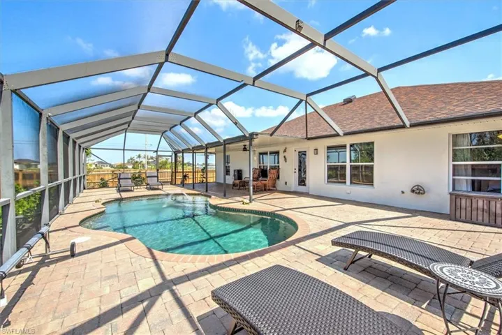 Spacious patio area with swimming pool...enjoy lounging and relaxing in sun or create an al-fresco dining area to entertain.