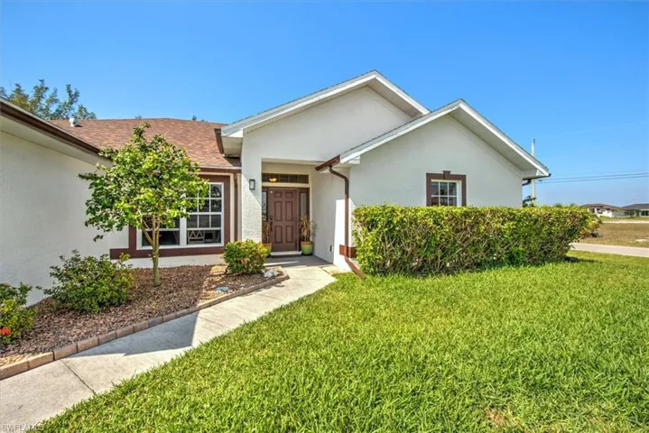 Well designed home with walkway to covered front entry.
