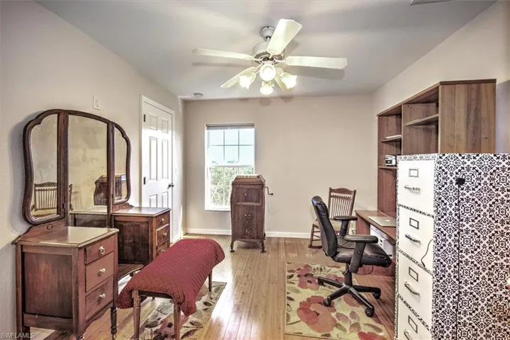 Bedroom 4 with bamboo wood flooring and ceiling fan.