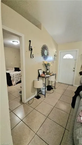 Foyer featuring tile patterned floors and baseboards