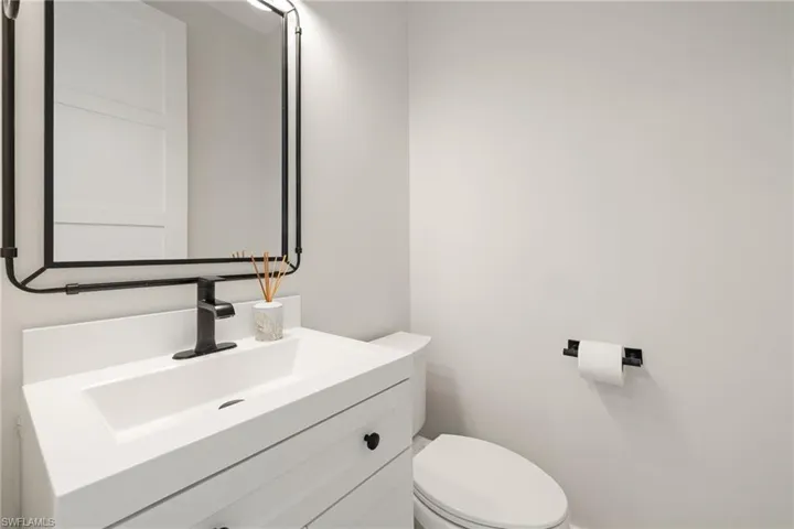 Bathroom featuring vanity and toilet