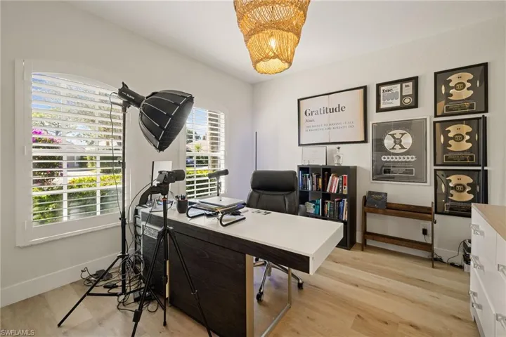 Office space featuring light wood finished floors and baseboards