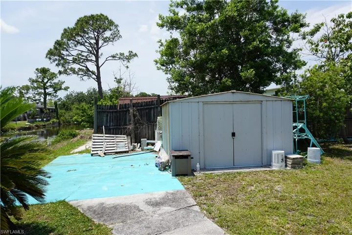 Back patio by canal would make a nice BBQ gathering spot