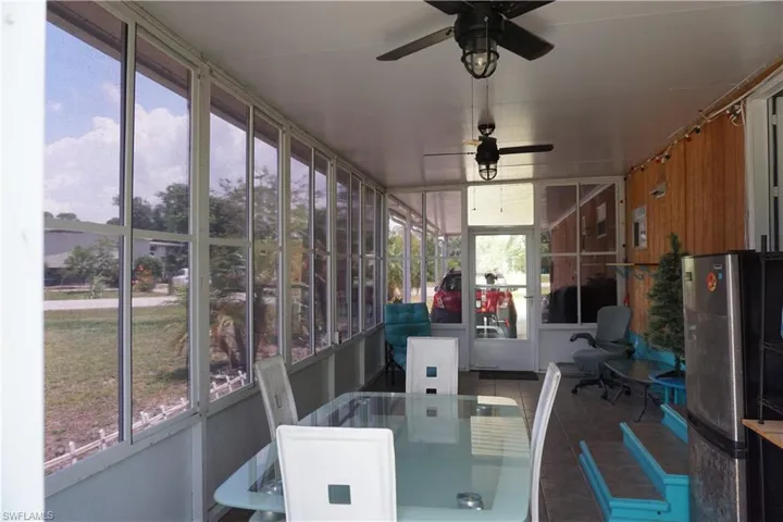 Enclosed lanai/Florida room is a nice gathering spot