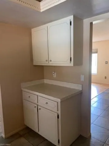 Kitchen featuring corner cabinets and countertop.