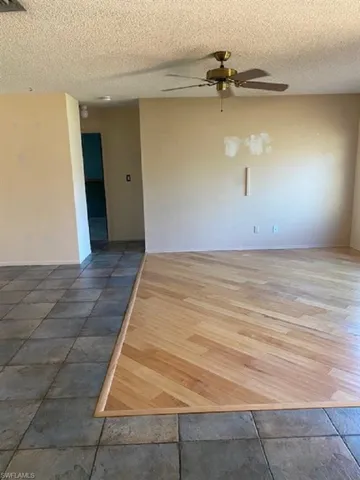 Family room with hardwood floor.