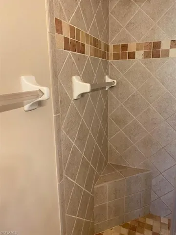 Master Bathroom walk in shower with bench.