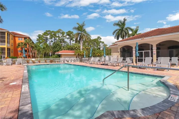 Community pool featuring a patio