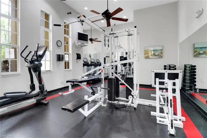 Gym featuring ceiling fan and recessed lighting
