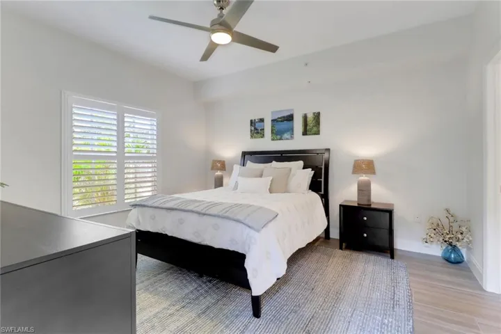 Bedroom featuring light wood-style flooring and ceiling fan