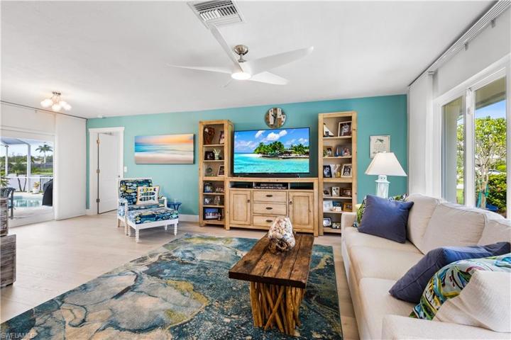 Your main living area has access to your pool deck. Fabulous views of the lake! Cool tomes throughout this home give a very contemporary feel!