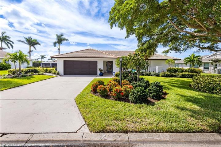 Fabulous curb appeal! Lush landscaping!