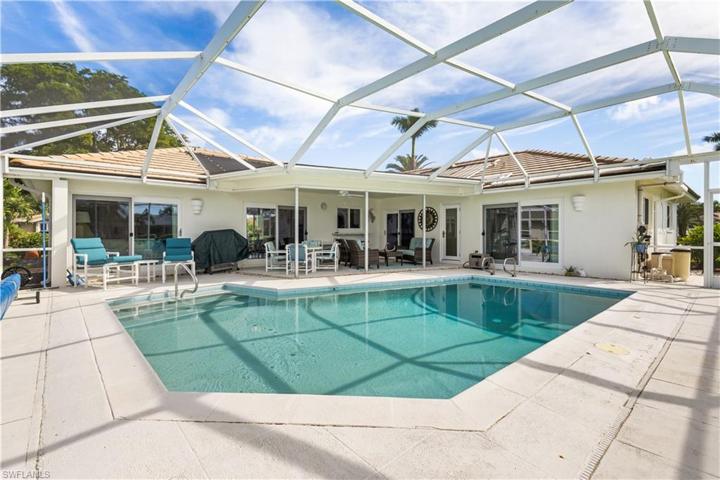 Inviting relaxation space on your pool deck overlooking the lake.