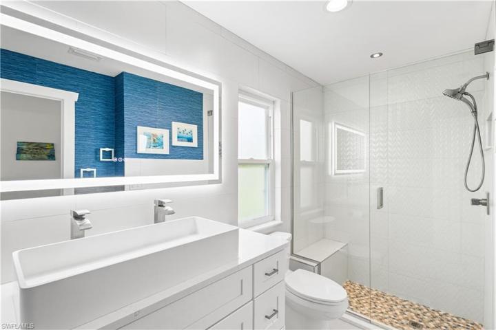 Remodeled master ensuite bath, walk in shower, seamless glass enclosure and door.