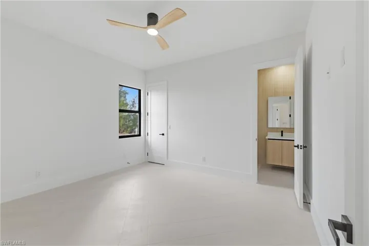 Unfurnished bedroom with baseboards and ceiling fan