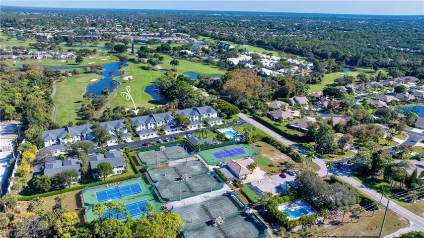 Aerial View of Tennis Courts and Property w/ Golf Course Views