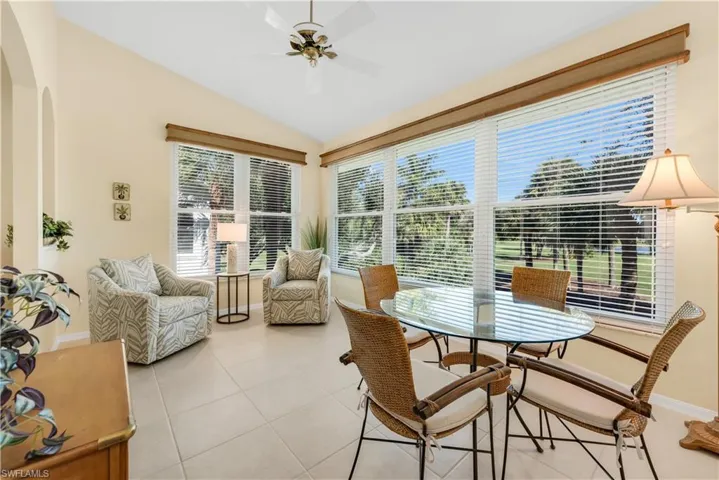 Sitting Room/Flex Space featuring Vaulted Ceiling, Tile Floors, and Plenty of Sunlight