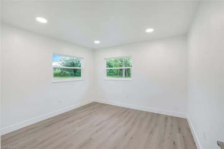 Spare room featuring light wood-style floors and recessed lighting