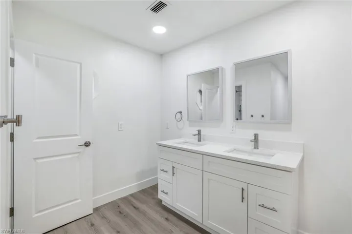 Bathroom featuring light wood finished floors and recessed lighting