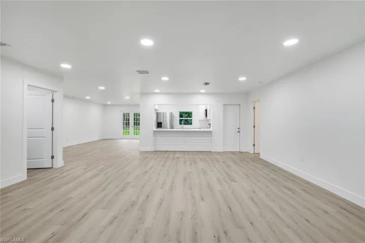 Unfurnished living room featuring recessed lighting and light wood-type flooring