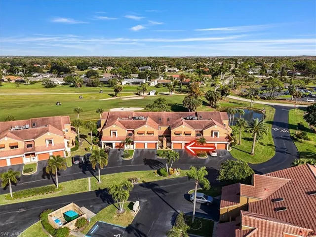 Aerial perspective of suburban area featuring a local golf course