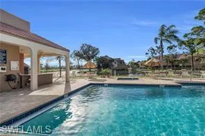 Community pool with a patio area