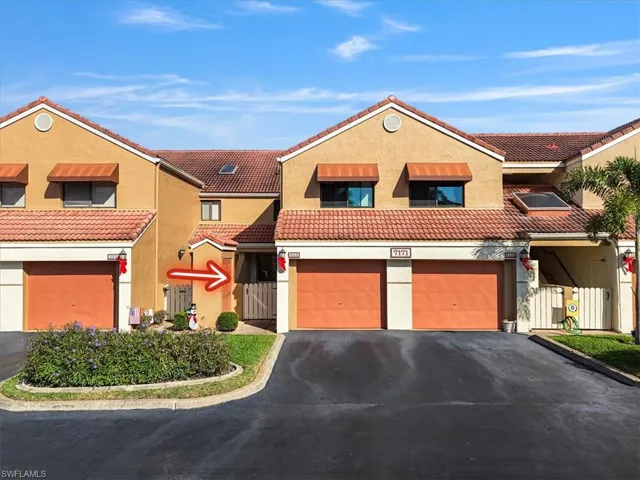Mediterranean / spanish-style home featuring driveway, stucco siding, a tiled roof, and a garage