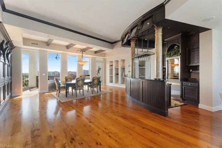 Wet bar and dining area with canal view