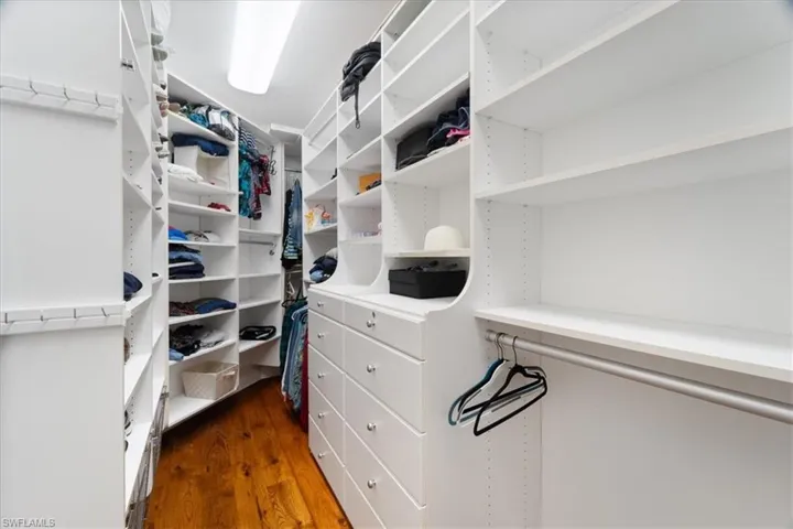 Owner's suite walk-in custom closet.