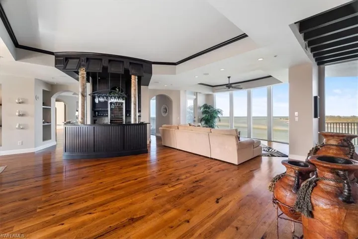 First living room with wet bar and ocean view.