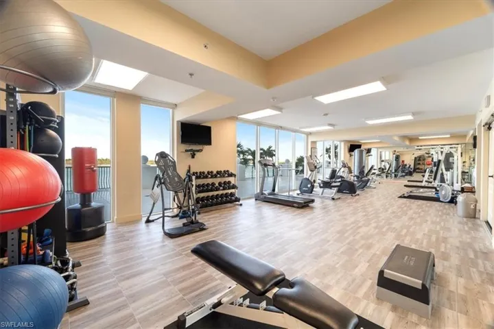 Workout area with floor to ceiling windows.