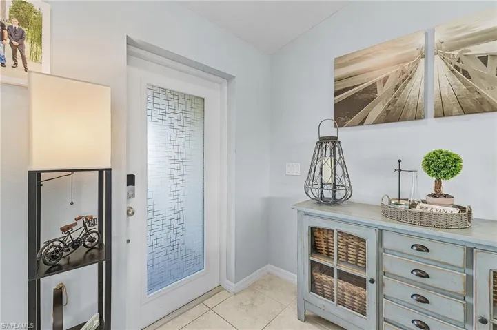 Doorway to outside featuring light tile patterned floors