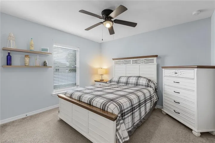 Bedroom with carpet flooring and ceiling fan