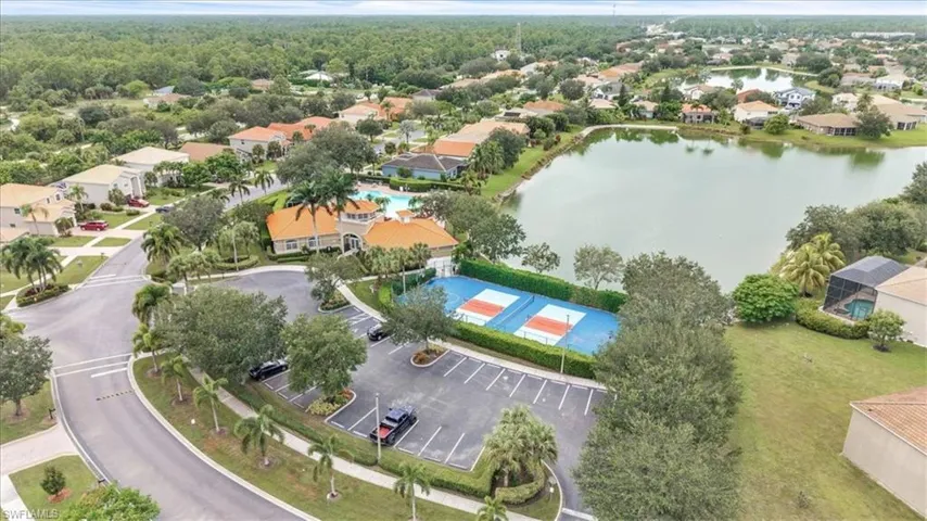 Aerial perspective of suburban area featuring a large body of water